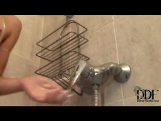 the girl washes her furry pussy and masturbates